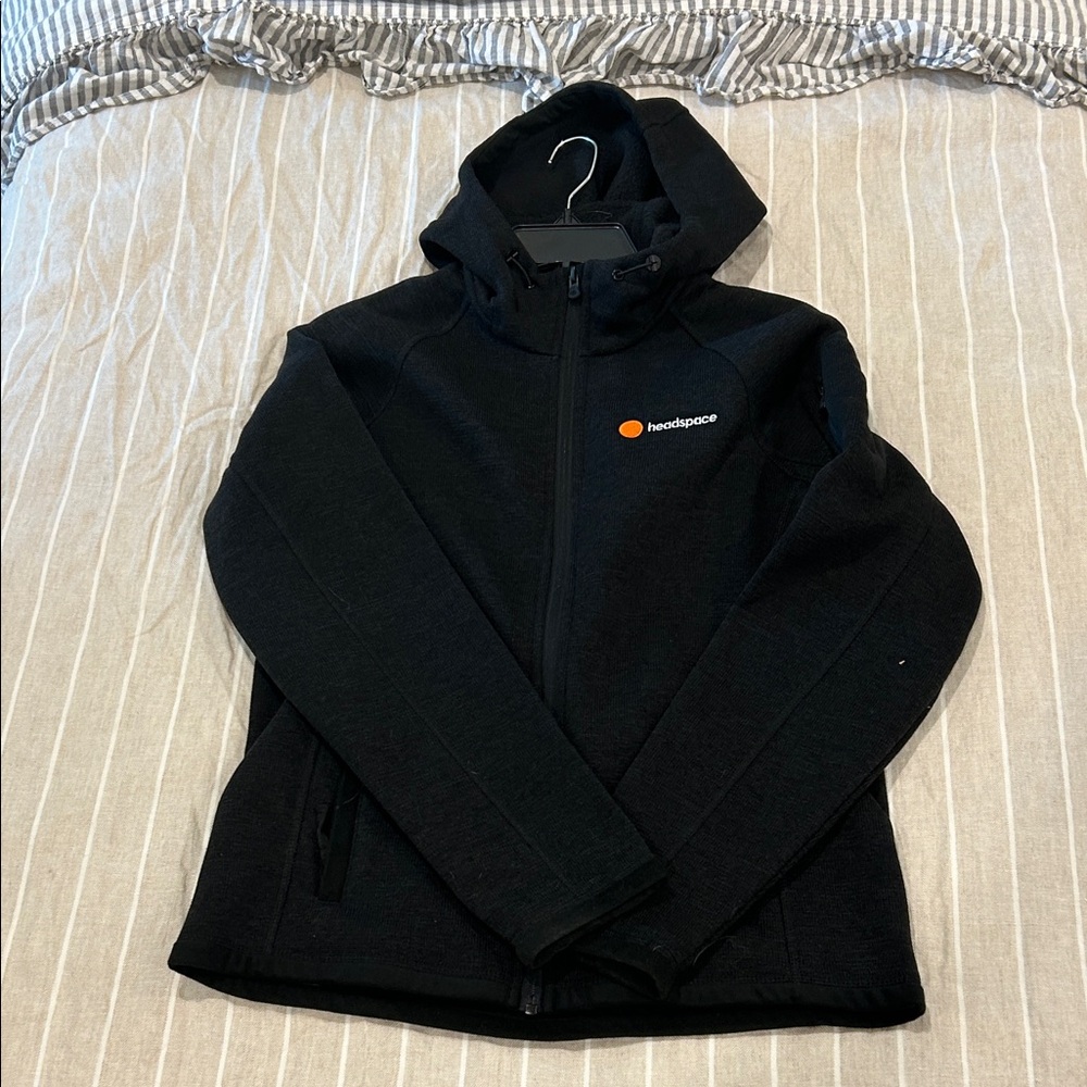 Storm black zip hoodie with orange accent